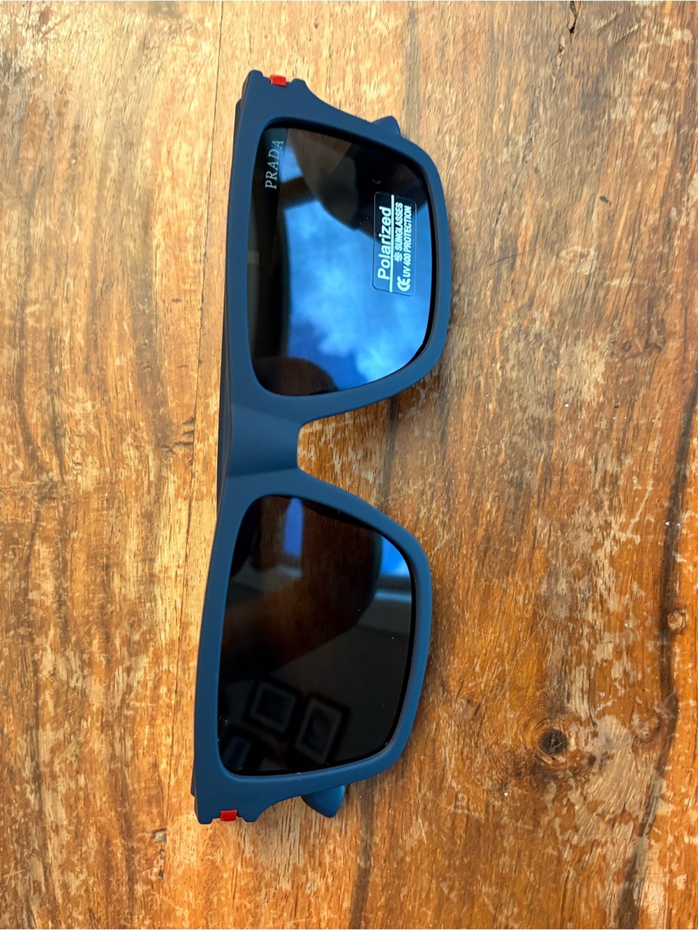 Prada Matte Navy Sunglasses with Red Temple Accent
